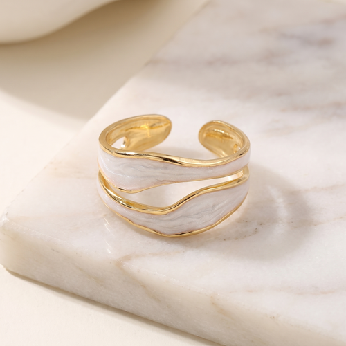 Enamel inlay adjustable ring in stainless steel, lying on white marble