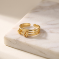 Thin adjustable open stacking ring, lying on white marble