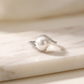 10mm baroque freshwater pearl ring on sterling silver, lying on white marble