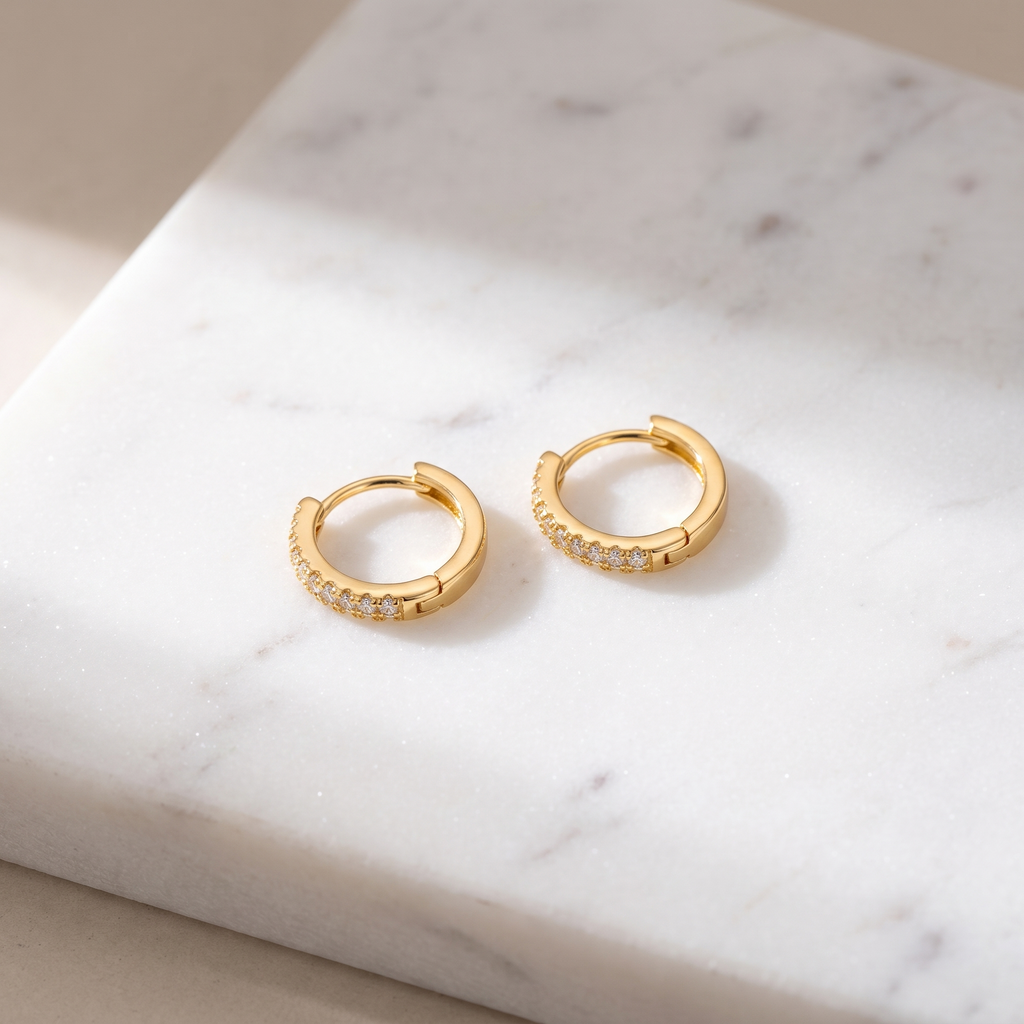 Zircon prong stud earrings on white marble