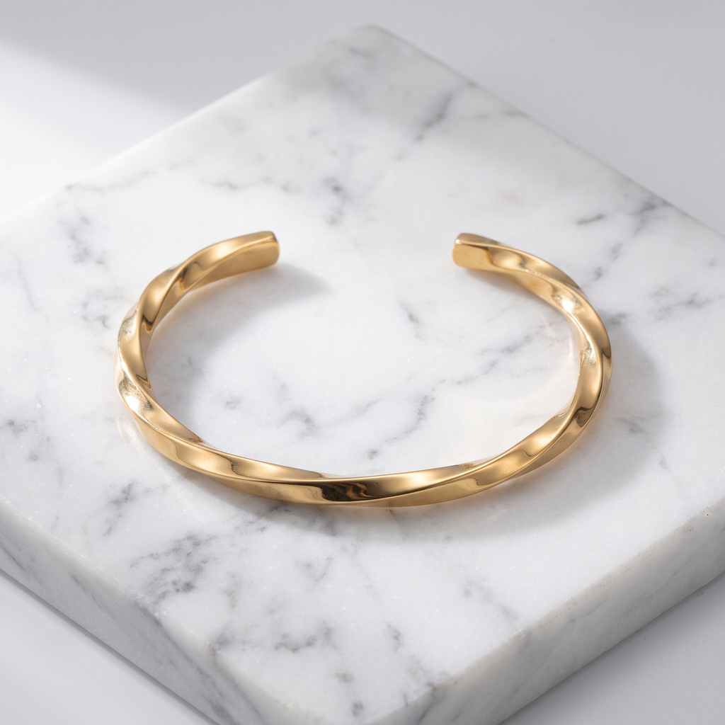 Twisted open cuff bracelet on white marble